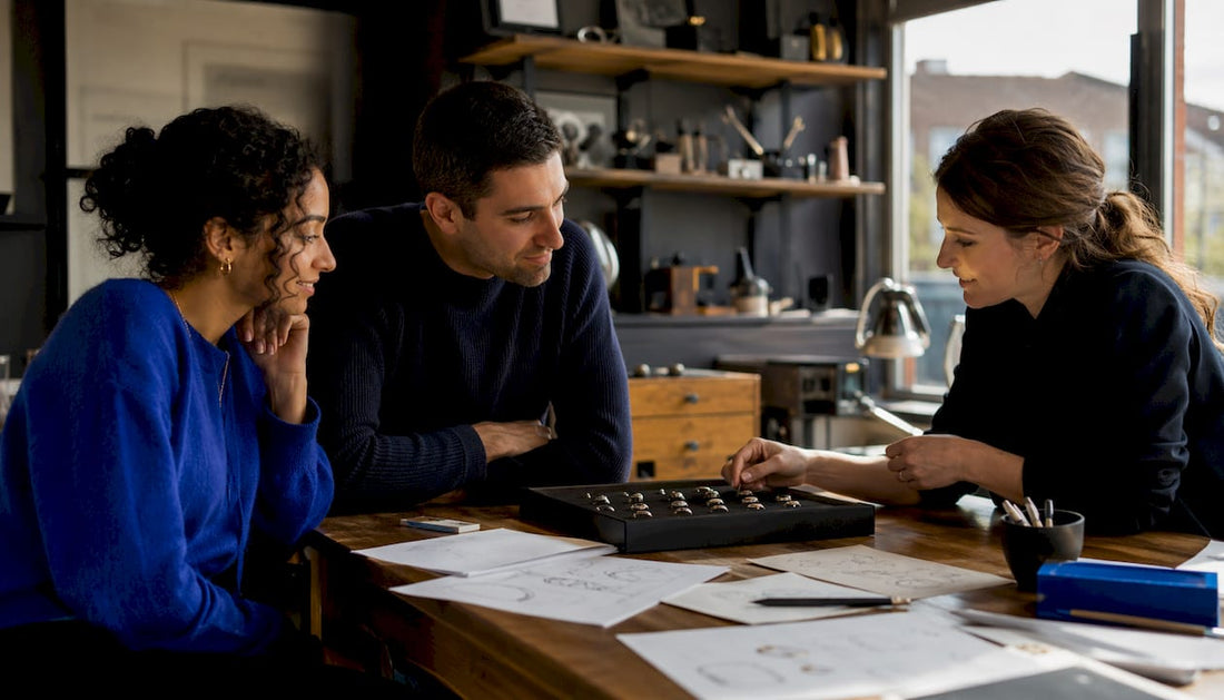 Couple consulting jeweller on handmade rings