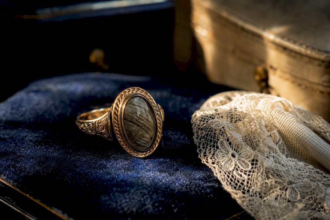 Close-up of Victorian mourning ring with hairwork panel