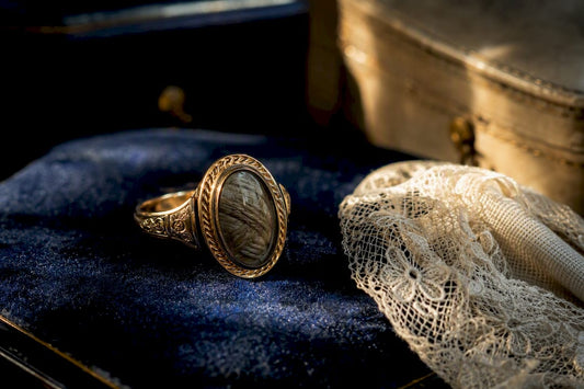 Close-up of Victorian mourning ring with hairwork panel