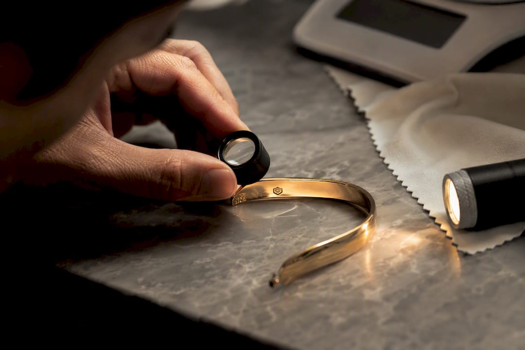 Close-up of hallmark inspection on silver jewellery