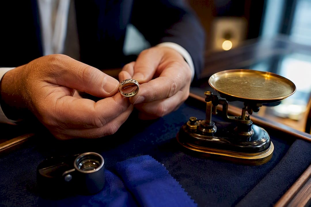 Jeweller examining an anonymous pre-owned ring