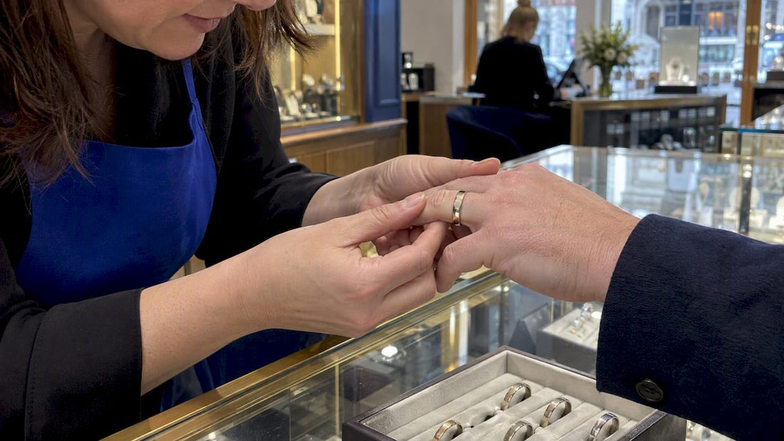 Jeweller checking D shaped ring fit