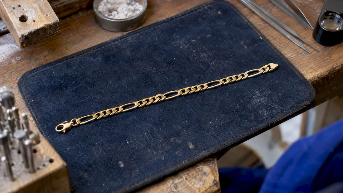 Gold Figaro bracelet showing its repeating link pattern