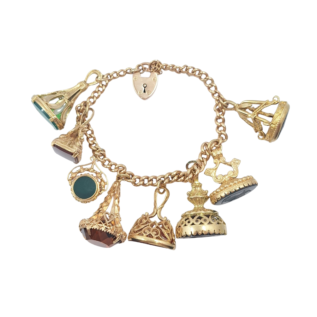 9ct Yellow Gold Charm Bracelet With Eight Fob Charms
