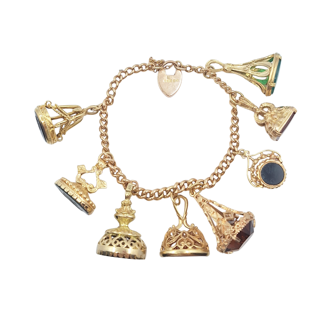 9ct Yellow Gold Charm Bracelet With Eight Fob Charms