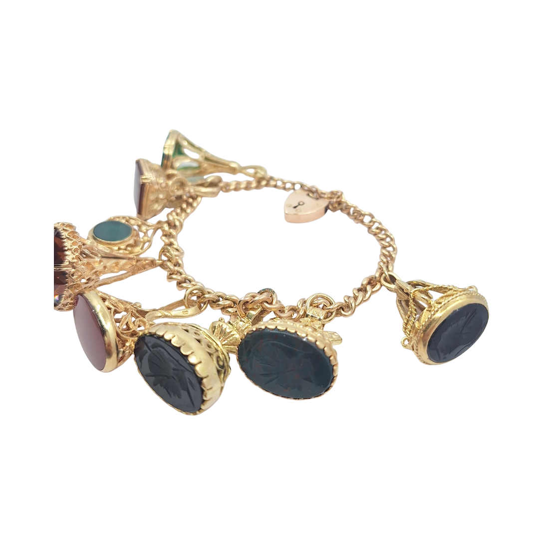 9ct Yellow Gold Charm Bracelet With Eight Fob Charms